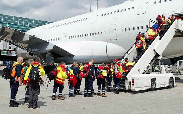 Members of a German rescue organization board a plane at the airport in Frankfurt, central Germany, Sunday, April 26, 2015, for their flight to earthquake-torn Nepal. (Christoph Schmidt/dpa via AP) Members of a German rescue organization board a plane at the airport in Frankfurt, central Germany, Sunday, April 26, 2015, for their flight to earthquake-torn Nepal. (Christoph Schmidt/dpa via AP)