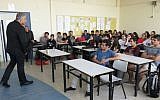 Yesh Atid chairman Yair Lapid speaks to high school students in Tel Aviv on April 15 2015. (Photo credit: Courtesy Yesh Atid)