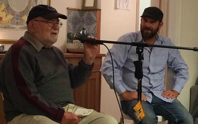 Michael Blain (left) gives testimony as his grandson Maayan Leshem looks on at 'Zikaron Basalon' gathering in Jerusalem, April 15, 2015. (photo credit: Renee Ghert-Zand/Times of Israel staff)