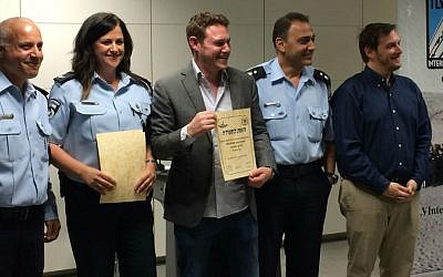 TLV Internationals' Jonathan Javor (center) participated in the the Civil Guard training course for new immigrants, which he initiated. (photo credit: Renee Ghert-Zand/Times of Israel staff)