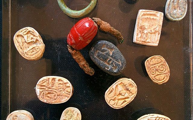 File: 18th Dynasty scarab seals and a carnelian signet ring found by IAA archaeologists in a cave near Tel Halif, in southern Israel (photo credit: Ilan Ben Zion/Times of Israel staff) File: 18th Dynasty scarab seals and a carnelian signet ring found by IAA archaeologists in a cave near Tel Halif, in southern Israel (photo credit: Ilan Ben Zion/Times of Israel staff)