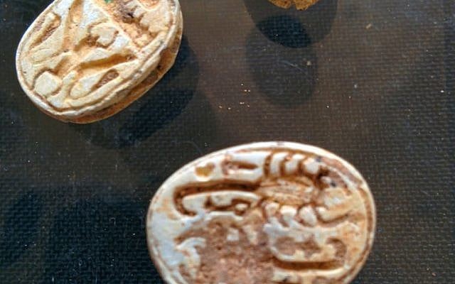File: Faience scarabs found by IAA archaeologists in a cave near Tel Halif, in southern Israel (photo credit: Ilan Ben Zion/Times of Israel staff) File: Faience scarabs found by IAA archaeologists in a cave near Tel Halif, in southern Israel (photo credit: Ilan Ben Zion/Times of Israel staff)