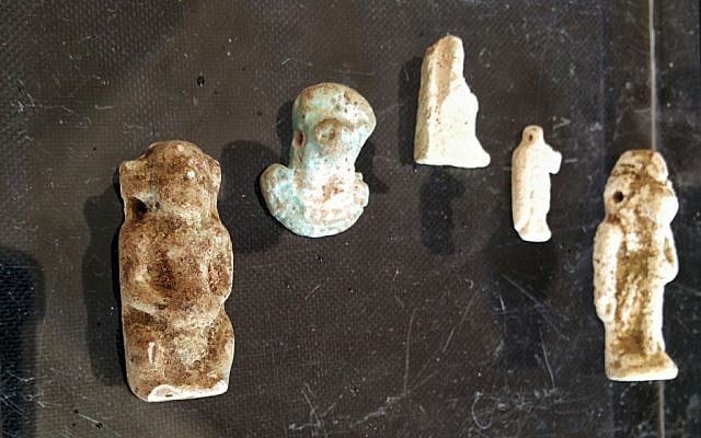 Egyptian-style faience amulets found by IAA archaeologists in a cave near Tel Halif, in southern Israel, at the Rockefeller Museum in Jerusalem (photo credit: Ilan Ben Zion/Times of Israel staff) Egyptian-style faience amulets found by IAA archaeologists in a cave near Tel Halif, in southern Israel, at the Rockefeller Museum in Jerusalem (photo credit: Ilan Ben Zion/Times of Israel staff)