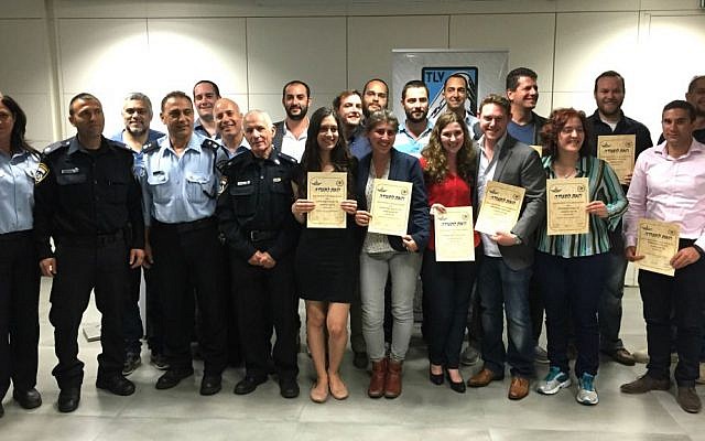 Fifteen new immigrants receive certificates upon completing their Civil Guard basic training, Tel Aviv, April 16, 2015. (photo credit: courtesy)
