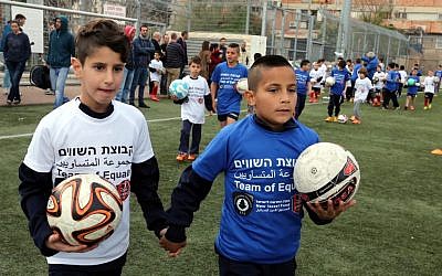 Arab and Jewish children living in Jerusalem practice soccer through the 'Team of Equals' initiative, March 19, 2015 (photo credit: courtesy/Yossi Zamir)