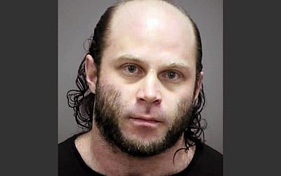In the Feb. 2, 2014 photo provided by the Rock County, Wisconsin, Sheriff’s Office is Joshua Van Haften, 34, of Madison, Wisconsin. Van Haften was arrested Wednesday, April 8, 2015 at O'Hare International Airport in Chicago after returning on a flight from Turkey. (photo credit: Rock County Sheriff’s Office via AP)