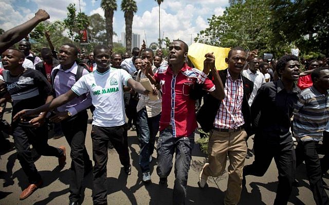 Kenyan students march in memory of the victims of the Garissa college attack and to protest what they say is a lack of security, in downtown Nairobi, Kenya, Tuesday, April 7, 2015. (AP Photo/Ben Curtis)