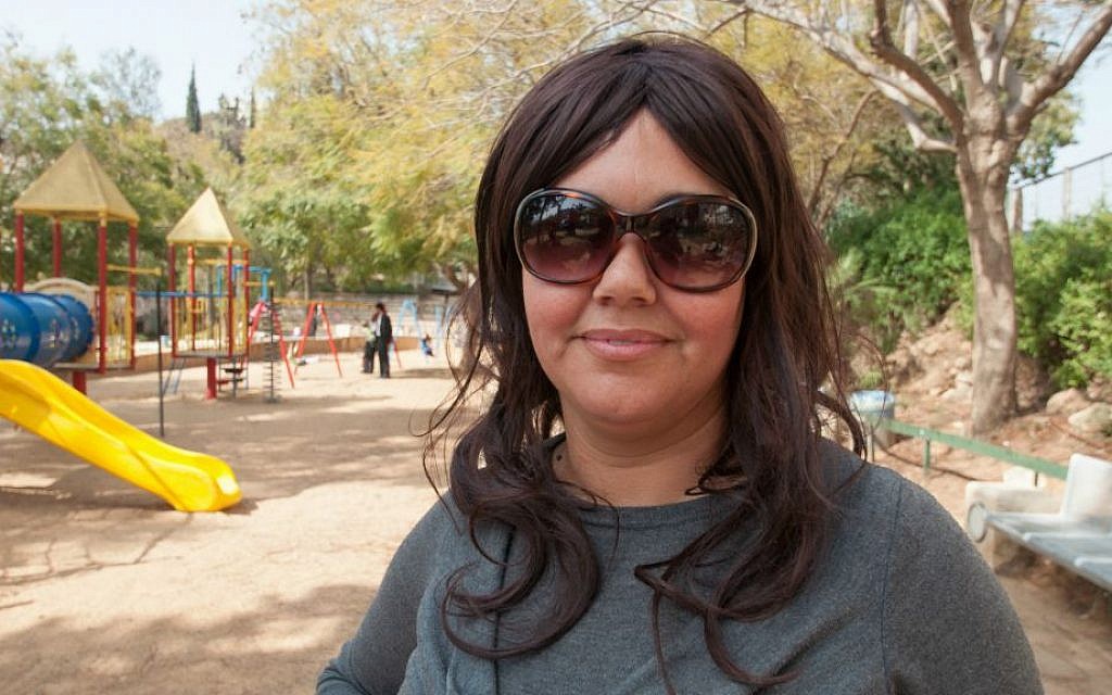 Maya, 42, at Akiva Gur Garden, Bnei Brak, lives in Bnei Brak: "For me, the hardest part of becoming religious was the clothing." (Photo credit: Judith Hertog)