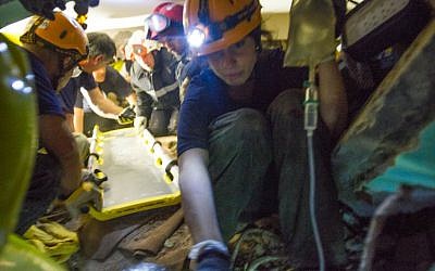 An Israeli-led team of rescuers works to extract a Nepalese woman from under the rubble of a collapsed hotel in Kathmandu on Thursday, April 30, 2015 (photo credit: IsraAID/Mickey Noam Alon) An Israeli-led team of rescuers works to extract a Nepalese woman from under the rubble of a collapsed hotel in Kathmandu on Thursday, April 30, 2015 (photo credit: IsraAID/Mickey Noam Alon)