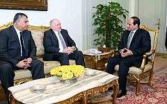 In this image provided by the office of the Egyptian Presidency, Egyptian President Abdel-Fattah el-Sissi, right, meets with CIA director John Brennan, center, and the director of Egypt’s General Intelligence Directorate Khaled Fawzy in Cairo, Sunday, April 19, 2015. (Egyptian Presidency via AP)