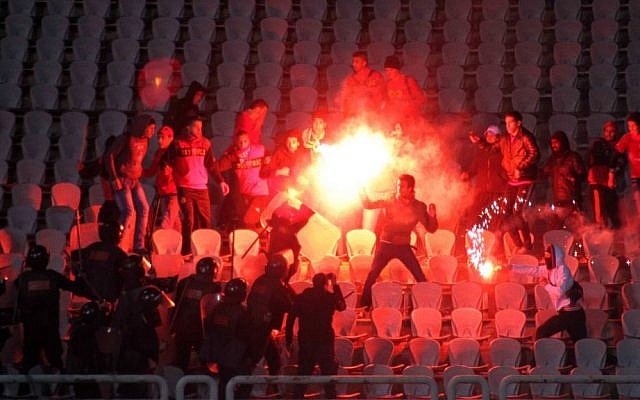 Illustration. Egyptian fans clash with riot police following a match at a soccer stadium in Port Said, Egypt in 2012. (Photo credit: AP) Illustration. Egyptian fans clash with riot police following a match at a soccer stadium in Port Said, Egypt in 2012. (Photo credit: AP)