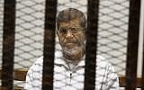 Egypt's ousted Islamist president Mohammed Morsi in a defendant cage in the Police Academy courthouse, May 8, 2014, in Cairo, Egypt. (Tarek el-Gabbas/AP/File)