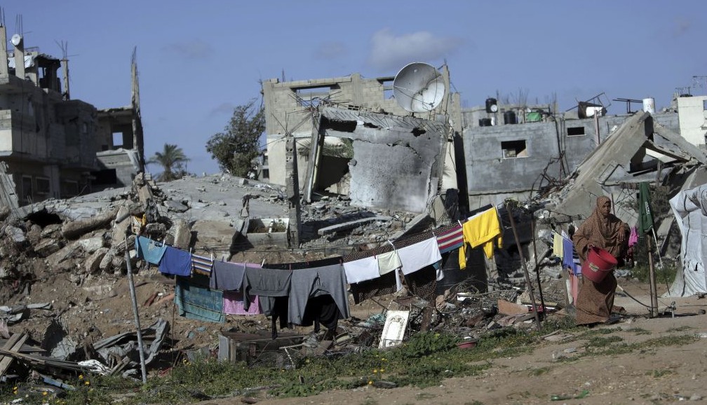 A Palestinian woman hangs washing next to the rubble of her destroyed house, in the Shijaiyah neighborhood of Gaza City, Monday, March 30, 2015. (AP/Khalil Hamra) A Palestinian woman hangs washing next to the rubble of her destroyed house, in the Shijaiyah neighborhood of Gaza City, Monday, March 30, 2015. (AP/Khalil Hamra)