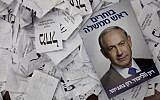 This March 18, 2015, photo, shows a Prime Minister Benjamin Netanyahu election campaign poster lying among ballot papers at his party's election headquarters in Tel Aviv. (AP/Dan Balilty)