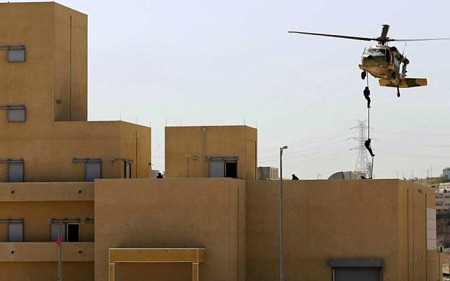 Jordanian forces conduct a military drill as part of the 7th Annual International Warrior Competition hosted by the King Abdullah Special Operations Training Center (KASOTC), Sunday, April 19, 2015, Amman, Jordan. (AP Photo/Raad Adayleh) Jordanian forces conduct a military drill as part of the 7th Annual International Warrior Competition hosted by the King Abdullah Special Operations Training Center (KASOTC), Sunday, April 19, 2015, Amman, Jordan. (AP Photo/Raad Adayleh)