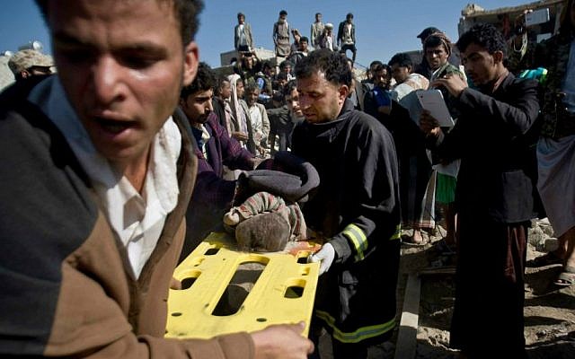 People carry the body of a child they uncovered under the rubble of houses destroyed by Saudi airstrikes near Sana'a Airport, Yemen, March 26, 2015. (photo credit: AP/Hani Mohammed, File) People carry the body of a child they uncovered under the rubble of houses destroyed by Saudi airstrikes near Sana'a Airport, Yemen, March 26, 2015. (photo credit: AP/Hani Mohammed, File)
