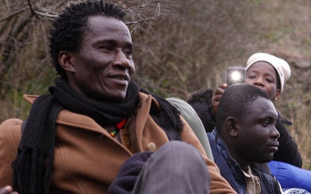 Resting on the way to the Greek-Macedonian border near the town of Evzonoi, Greece, on February 28, 2015. (photo credit: AP/Dalton Bennett) Resting on the way to the Greek-Macedonian border near the town of Evzonoi, Greece, on February 28, 2015. (photo credit: AP/Dalton Bennett)