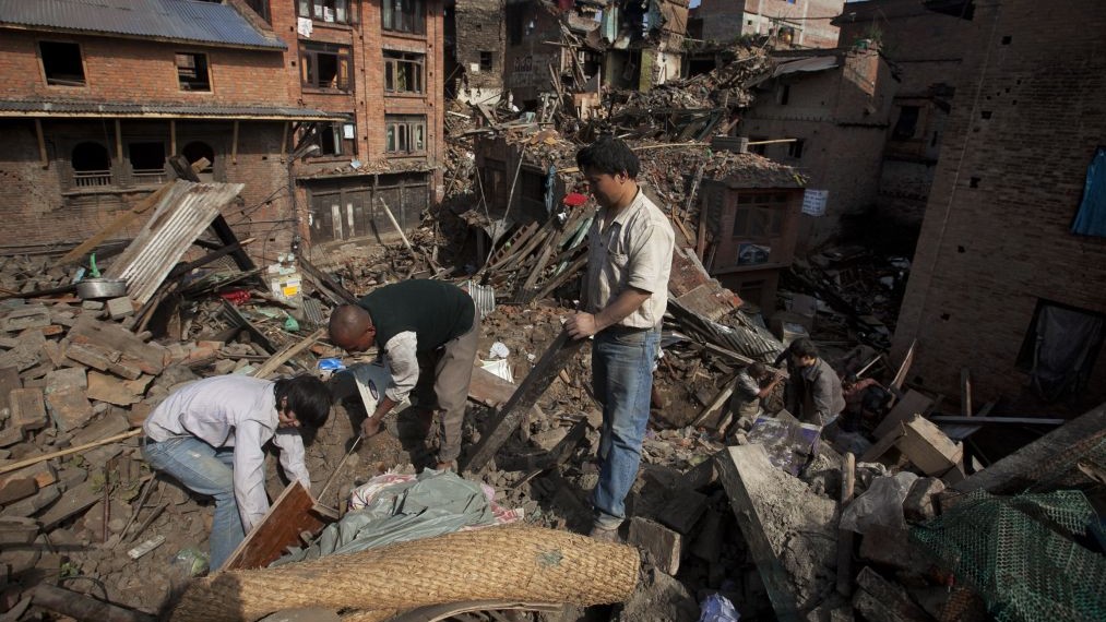 A Nepalese family collects belongings from their home destroyed in Saturday's earthquake, in Bhaktapur on the outskirts of Kathmandu, Nepal, Monday, April 27, 2015. (photo credit: AP/Niranjan Shrestha) A Nepalese family collects belongings from their home destroyed in Saturday's earthquake, in Bhaktapur on the outskirts of Kathmandu, Nepal, Monday, April 27, 2015. (photo credit: AP/Niranjan Shrestha)