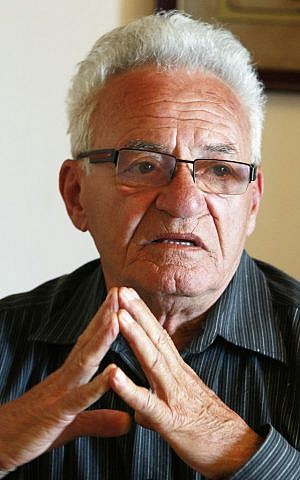 Moshe Tirosh, 78, during an interview in Warsaw, Poland on Friday, April 10, 2015, recalls hiding in a villa on the grounds of the Warsaw zoo for three weeks during World War II (Photo credit: Czarek Sokolowski/AP)