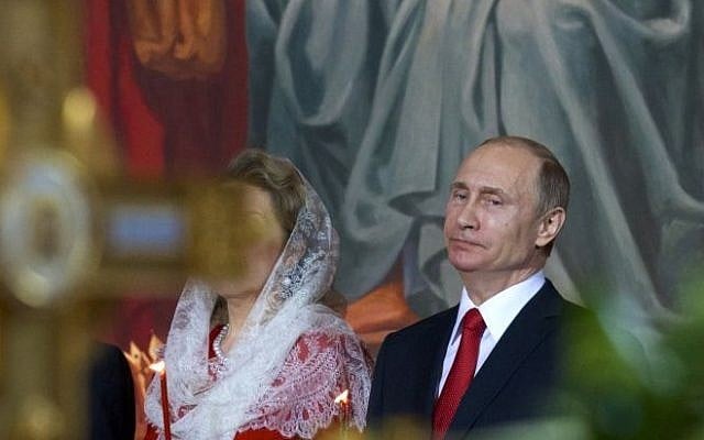 Russian President Vladimir Putin attends the Easter service in Christ the Savior Cathedral in Moscow, Russia, April 12, 2015. (photo credit: AP/Ivan Sekretarev)