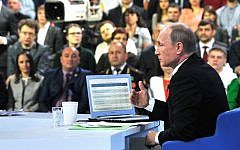 Russian President Vladimir Putin speaks during an annual call-in show on Russian television 'Conversation With Vladimir Putin' in Moscow, Apr. 16, 2015. (Photo credit: Mikhail Klimentyev/ RIA Novosti, Presidential Press Service)
