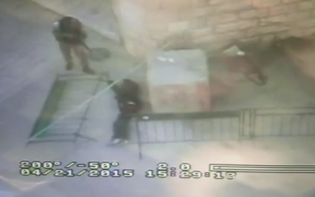 Screen capture from footage of what police said was a Palestinian man stabbing a Border Police officer in Hebron on Saturday, April 25, 2015. (screen capture: Israel Police video) Screen capture from footage of what police said was a Palestinian man stabbing a Border Police officer in Hebron on Saturday, April 25, 2015. (screen capture: Israel Police video)