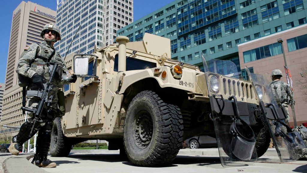 Maryland National Guardsmen patrol near downtown businesses in Baltimore, Tuesday, April 28, 2015, a day after looting and arson erupted following the funeral of Freddie Gray. (AP Photo/Patrick Semansky) Maryland National Guardsmen patrol near downtown businesses in Baltimore, Tuesday, April 28, 2015, a day after looting and arson erupted following the funeral of Freddie Gray. (AP Photo/Patrick Semansky)