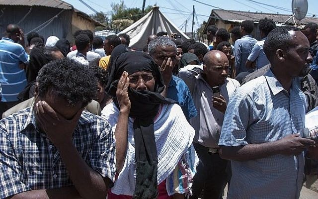 Ethiopians mourn for relatives and friends killed by the Islamic State group, as they gather in streets of the Ethiopian capital, Addis Ababa on April 21, 2015. (Photo credit: AFP/ELIAS ASMARE)