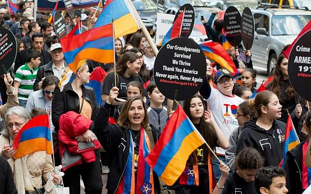 Pro-Armenian activists march in midtown Manhattan in New York on Sunday, April 26, 2015, to mark the centennial of the killings of 1.5 million Armenians under the Ottoman Empire — today's Turkey. The activists are demanding that the US government recognize the killings, which took place before and during World War I, as genocide. (Photo credit: AP/Mark Lennihan) Pro-Armenian activists march in midtown Manhattan in New York on Sunday, April 26, 2015, to mark the centennial of the killings of 1.5 million Armenians under the Ottoman Empire — today's Turkey. The activists are demanding that the US government recognize the killings, which took place before and during World War I, as genocide. (Photo credit: AP/Mark Lennihan)