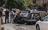 Illustrative: Police at the scene where a car bomb went off in Givatayim near Tel Aviv on April 26, 2015, injuring three people. Police believe that the blast was criminally motivated. (Flash90)