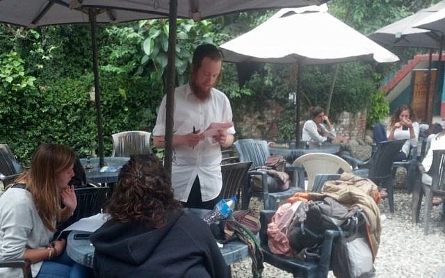 Workers at the Chabad House go over lists of names on April 30, 2015 in an effort to locate Israelis who have not made contact in the past few days. (Photo credit: Melanie Lidman/Times of Israel) Workers at the Chabad House go over lists of names on April 30, 2015 in an effort to locate Israelis who have not made contact in the past few days. (Photo credit: Melanie Lidman/Times of Israel)