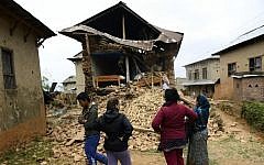 Israeli volunteers and local Nepali residents in the village of Manegau in the Kabri district, where Tevel B‘Tzedek is working, which was heavily damaged in Saturday‘s earthquake. (photo courtesy Tevel B‘Tzedek)