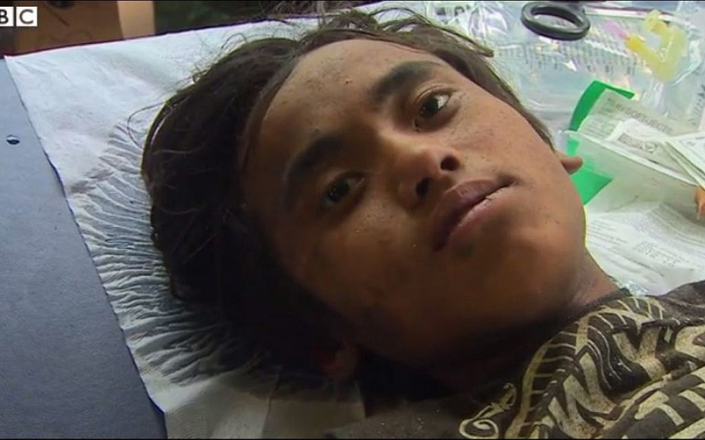 A boy saved from the rubble five days  after the earthquake in Nepal, Thursday, April 30, 2015. He survived by eating butter, he said. (screen capture: BBC)