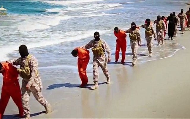 This undated image made from a video released by Islamic State militants on April 19, 2015, appears to show the killing of a group of captured Ethiopian Christians in Libya. (Militant video via AP) This undated image made from a video released by Islamic State militants on April 19, 2015, appears to show the killing of a group of captured Ethiopian Christians in Libya. (Militant video via AP)