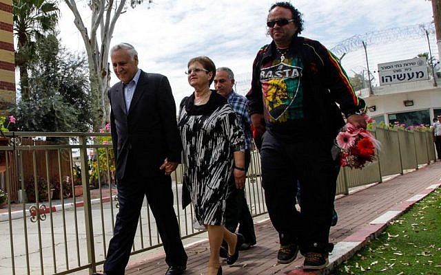 Former President Moshe Katsav, who is serving a seven-year sentence for rape, seen leaving Ma'asiyahu Prison with his wife Gila for a Passover furlough on April 3, 2015. (Flash90) Former President Moshe Katsav, who is serving a seven-year sentence for rape, seen leaving Ma'asiyahu Prison with his wife Gila for a Passover furlough on April 3, 2015. (Flash90)