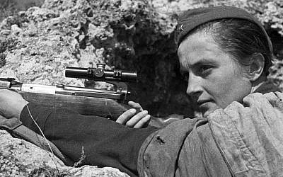 A file picture taken on June 6, 1942 shows Red Army Soviet sniper Lyudmila Pavlichenko holding a rifle as she defends Sevastopol from the Nazis. A Russian-language film about Ukrainian-born Pavlichenko, nicknamed "Lady Death", is targeting rare box office success in both Russia and Ukraine -- despite the crisis that has turned the two ex-Soviet nations against each other.(Photo credit: AFP/ RIA Novosti/Ozersky)