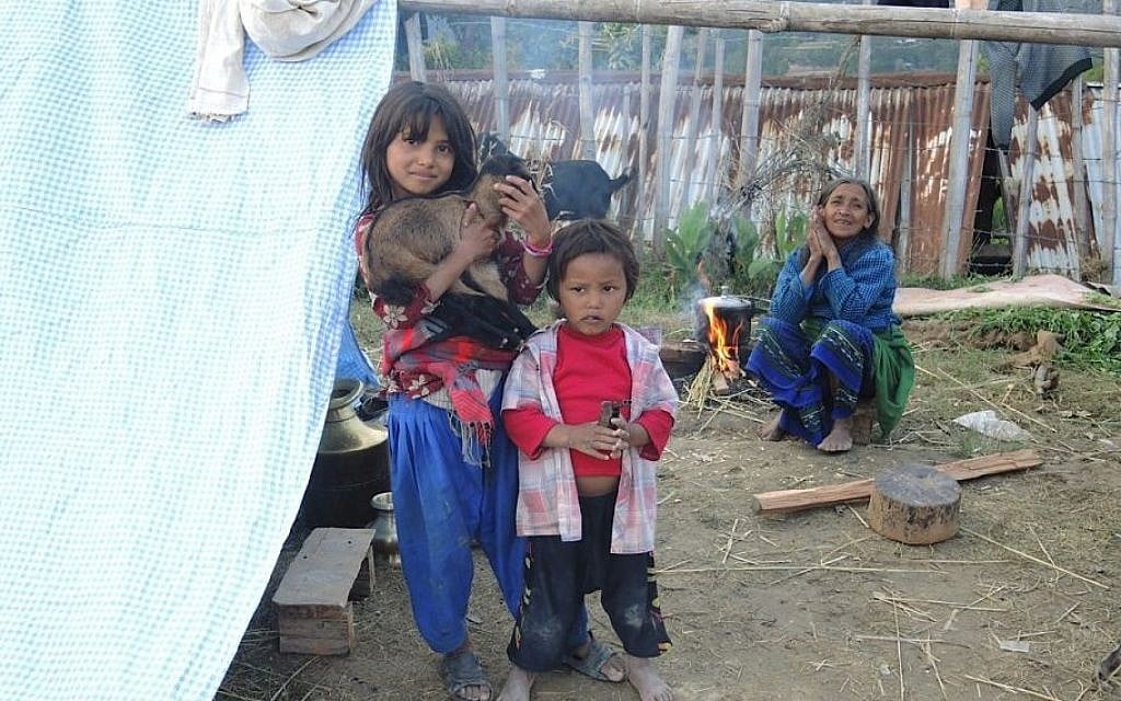 Children outside a tent on Thursday April 30, 2015 where they have been sleeping for the past few nights, due to fear of aftershocks. (Photo credit: Melanie Lidman/Times of Israel)