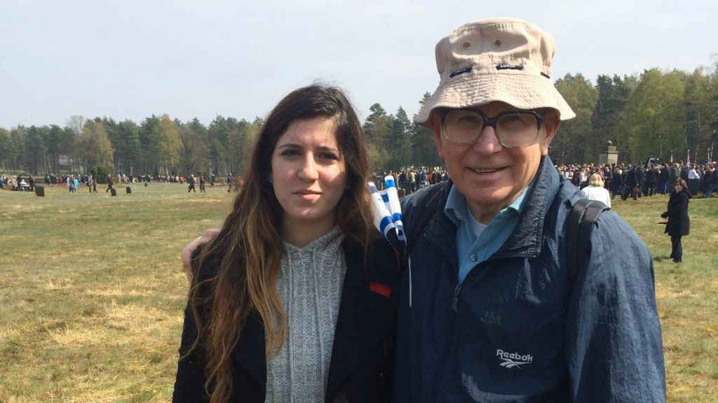 memorial_ceremony_2 Shaul Ladany, a survivor of the Bergen-Belsen concentration camp, attends the memorial ceremony with his granddaughter Shaked (Photo credit: Renee Ghert-Zand)