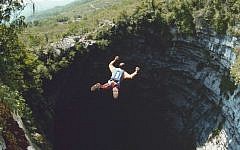 Omer Mei-Dan jumps into the Cave of Swallows, a 1,200-foot-deep site in Mexico. (Courtesy Omer Mei-Dan/JTA)