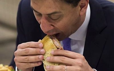 Labor leader Ed Miliband grapples with a bacon sandwich in May 2014 (YouTube screenshot)