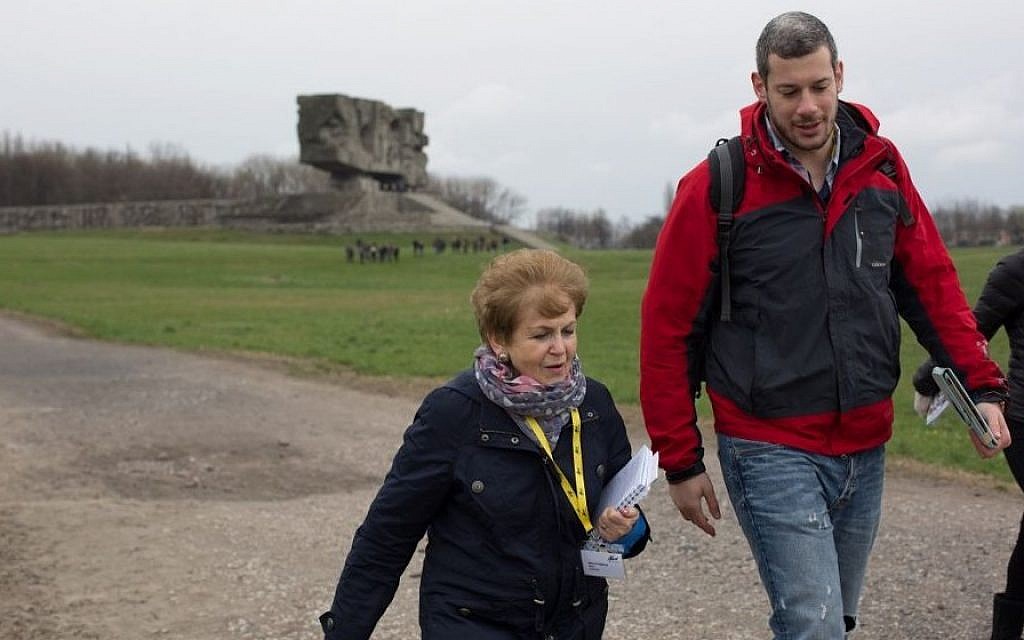 Mala Tribich with UK March of the Living volunteer Johnny Bunt, in Majdanek. (Photo credit: Sam Churchill Photography)