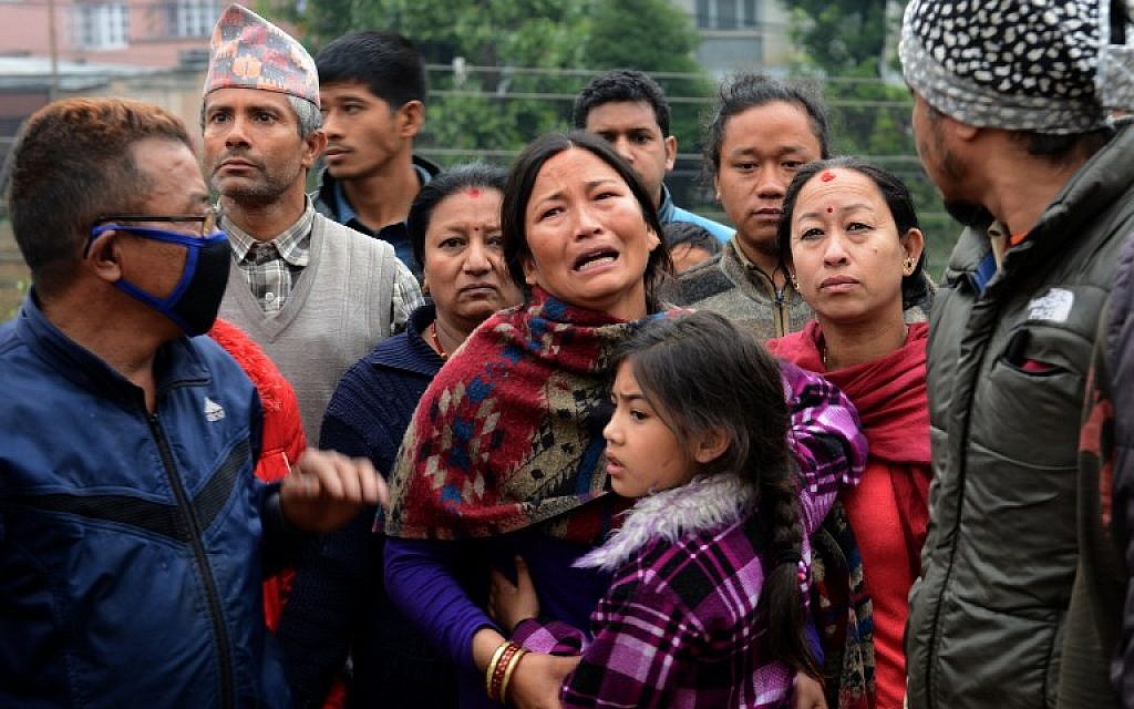 A Nepalese resident mourns the death of a relative following an earthquake in Kathmandu on April 26, 2015. (photo credit: AFP PHOTO / PRAKASH MATHEMA)