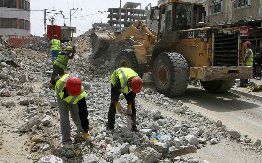 Palestinian workers rebuild the commercial center, destroyed by Israeli shelling during Operation Protective Edge, in Rafah in the southern Gaza Strip, on April 20, 2015. The reconstruction is funded by the United Nations Development Program (UNDP). (Abed Rahim Khatib/Flash 90) Palestinian workers rebuild the commercial center, destroyed by Israeli shelling during Operation Protective Edge, in Rafah in the southern Gaza Strip, on April 20, 2015. The reconstruction is funded by the United Nations Development Program (UNDP). (Abed Rahim Khatib/Flash 90)