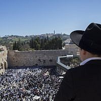 A young man looks down at the thousands gathered at the Western Wall for the annual priestly blessing April 6, 2015. (Photo credit: Yonatan Sindel/Flash90) A young man looks down at the thousands gathered at the Western Wall for the annual priestly blessing April 6, 2015. (Photo credit: Yonatan Sindel/Flash90)