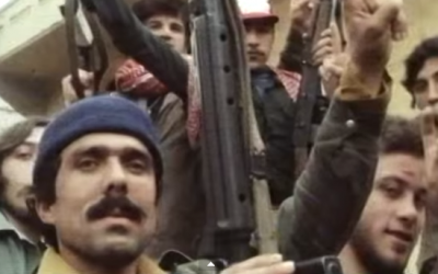 PLO fighters gesture towards a camera during the early years of the Lebanese Civil War. (screen capture: YouTube)