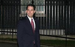 In this Feb. 10, 2015 file photo, Wisconsin Gov. Scott Walker leaves 10 Downing street after a private meeting with British Prime Minister David Cameron in London, England (photo credit: AP/Tim Ireland, File)