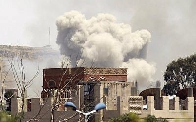 Smoke rises above the Alhva camp, east of the Yemeni capital, Sanaa, on April 17, 2015, following an alleged air strike by the Saudi-led alliance on Shiite Houthi rebels camps. (photo credit: AFP/Mohammed Huwais)