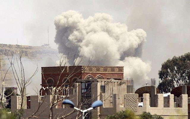 Smoke rises above the Alhva camp, east of the Yemeni capital, Sanaa, on April 17, 2015, following an alleged air strike by the Saudi-led alliance on Shiite Houthi rebels camps. (photo credit: AFP/Mohammed Huwais)