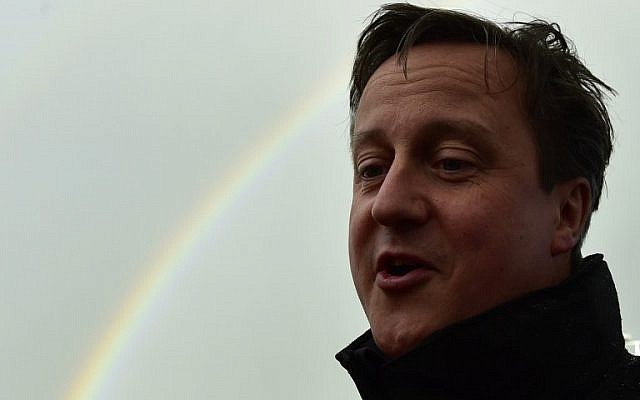 Britain's Prime Minister David Cameron speaks to journalists as he arrives at a construction site in Devon, southwest England, during a UK general-election campaign visit, on May 5, 2015. (photo credit: AFP/Toby Melville) Britain's Prime Minister David Cameron speaks to journalists as he arrives at a construction site in Devon, southwest England, during a UK general-election campaign visit, on May 5, 2015. (photo credit: AFP/Toby Melville)