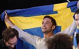 Sweden's Mans Zelmerlow reacts after winning the Eurovision Song Contest final on May 23, 2015 in Vienna.  (AFP PHOTO / DIETER NAGL)